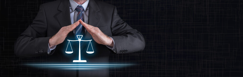 Person in a suit forming a roof shape over a glowing scales-of-justice icon on a dark background.