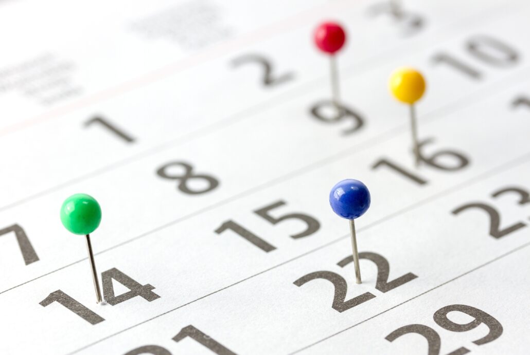 Calendar marked September 15 with a short tax checklist and a laptop.