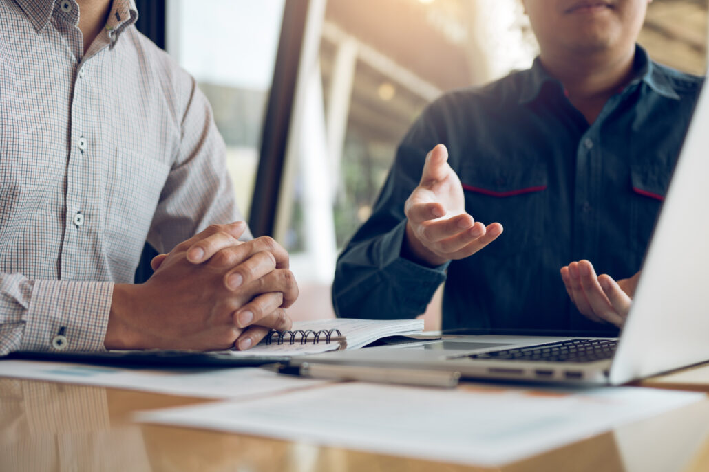 two professionals meeting to review January tax planning and strategy