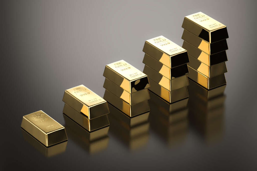 Stacked gold bars increasing in height, suggesting rising gold prices and retirement planning decisions in 2026
